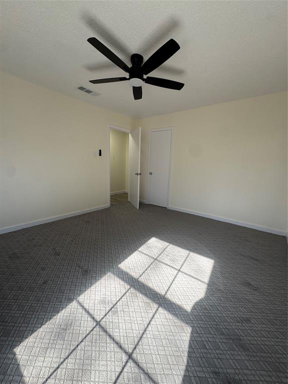 214 East Acheson Street Denison, TX 75021 - Photo 11 of 20 an empty room with wooden floor and windows