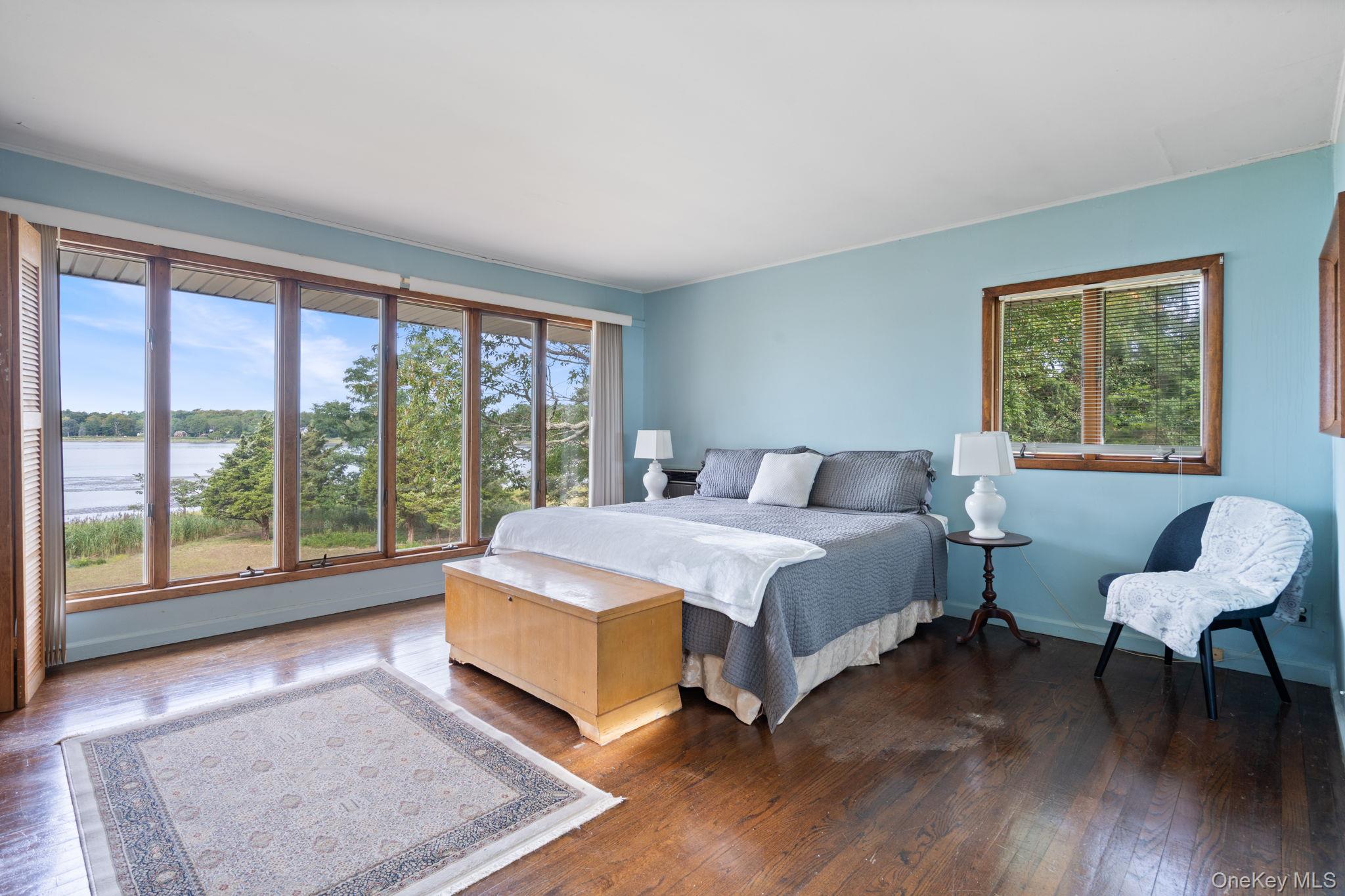 24 Conscience Circle Setauket, NY 11733 - Photo 14 of 31 a bedroom with a bed and a large window