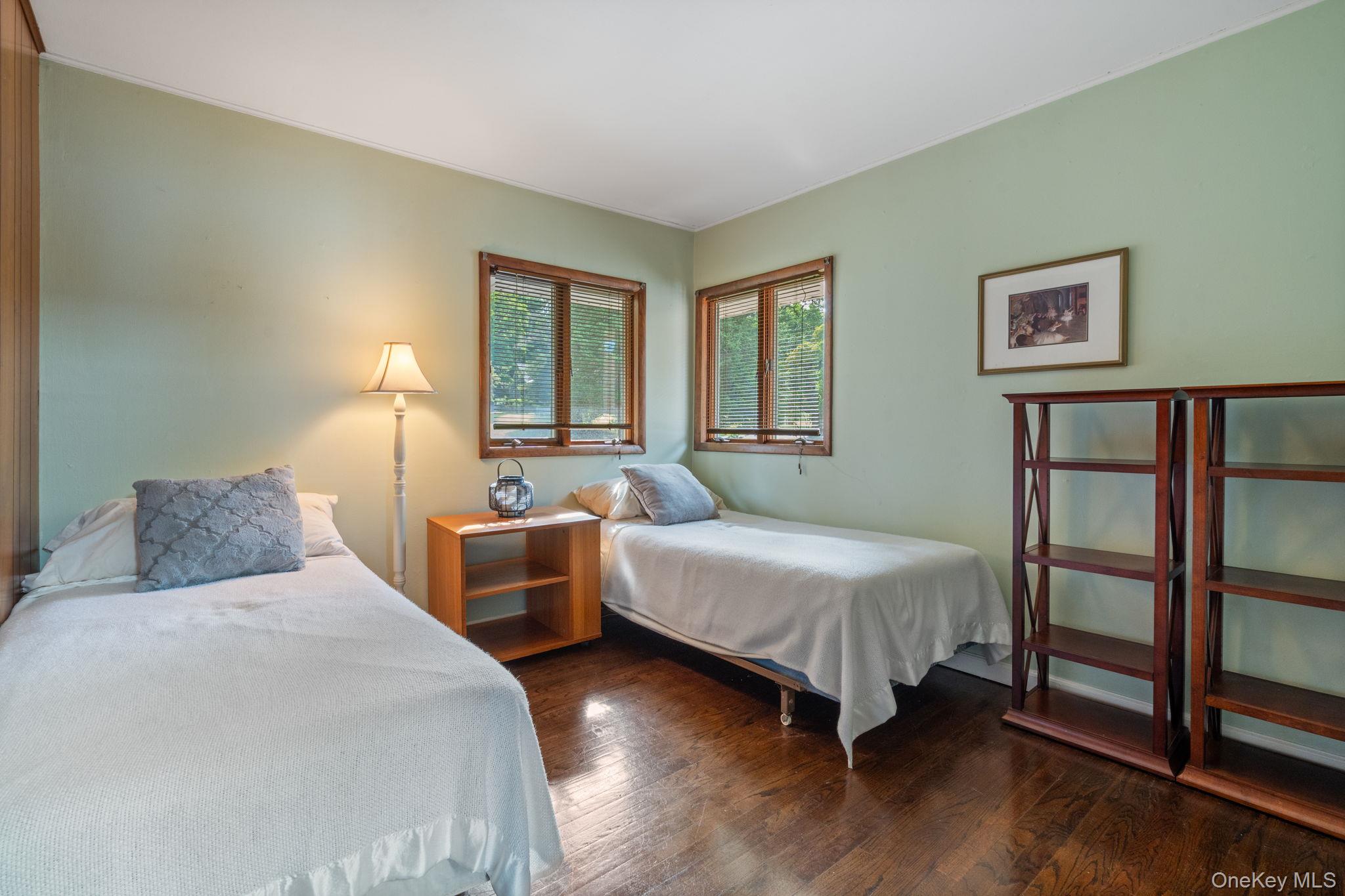 24 Conscience Circle Setauket, NY 11733 - Photo 18 of 31 a bedroom with two beds and a window