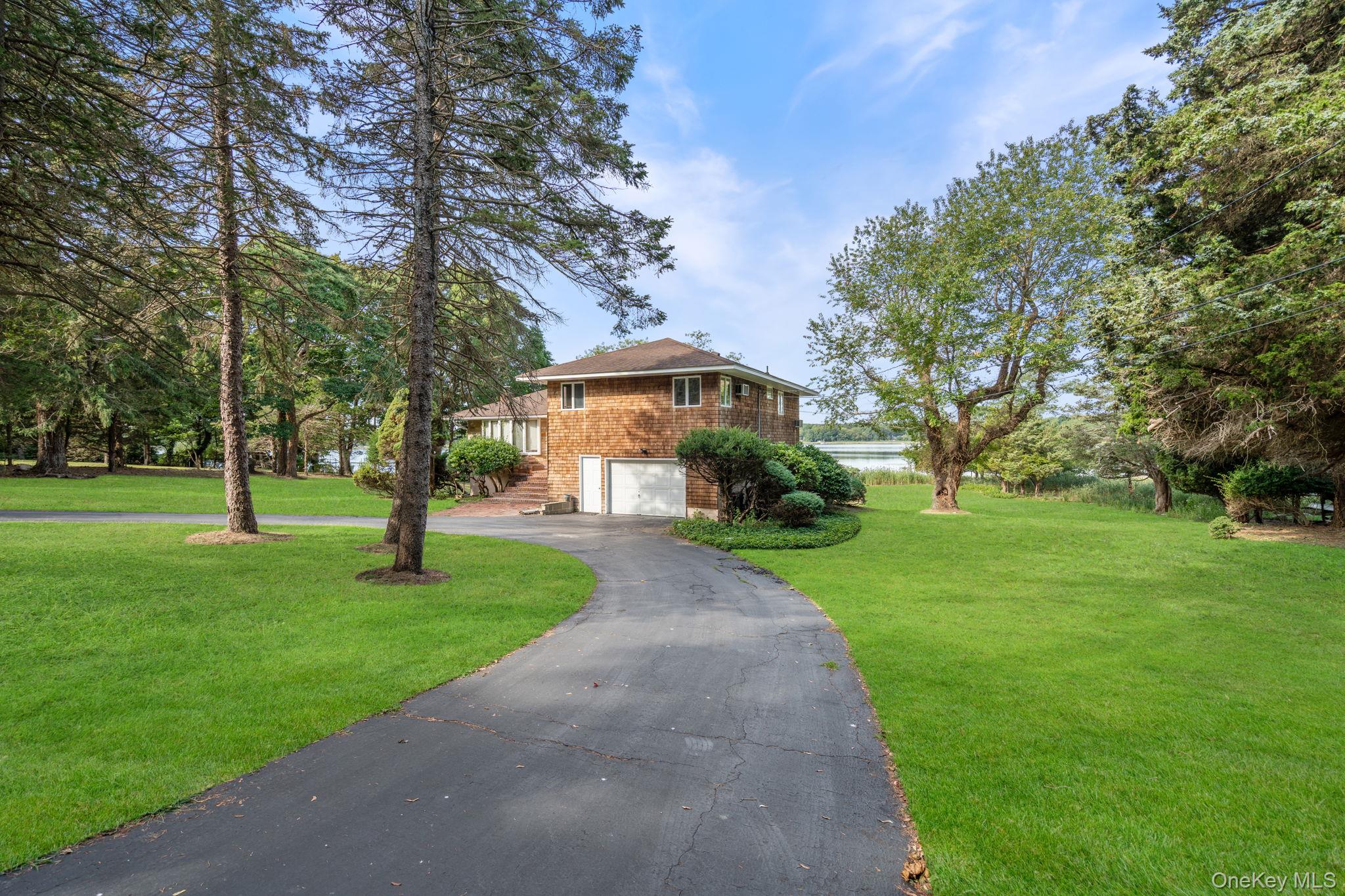 24 Conscience Circle Setauket, NY 11733 - Photo 2 of 31 a view of a park with a tree