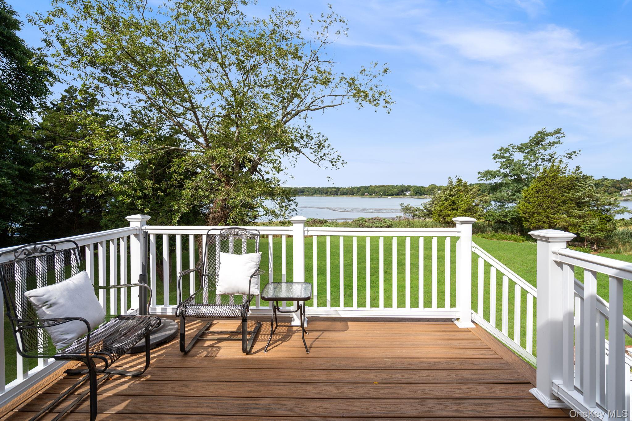 24 Conscience Circle Setauket, NY 11733 - Photo 23 of 31 a view of balcony with wooden floor and outdoor seating