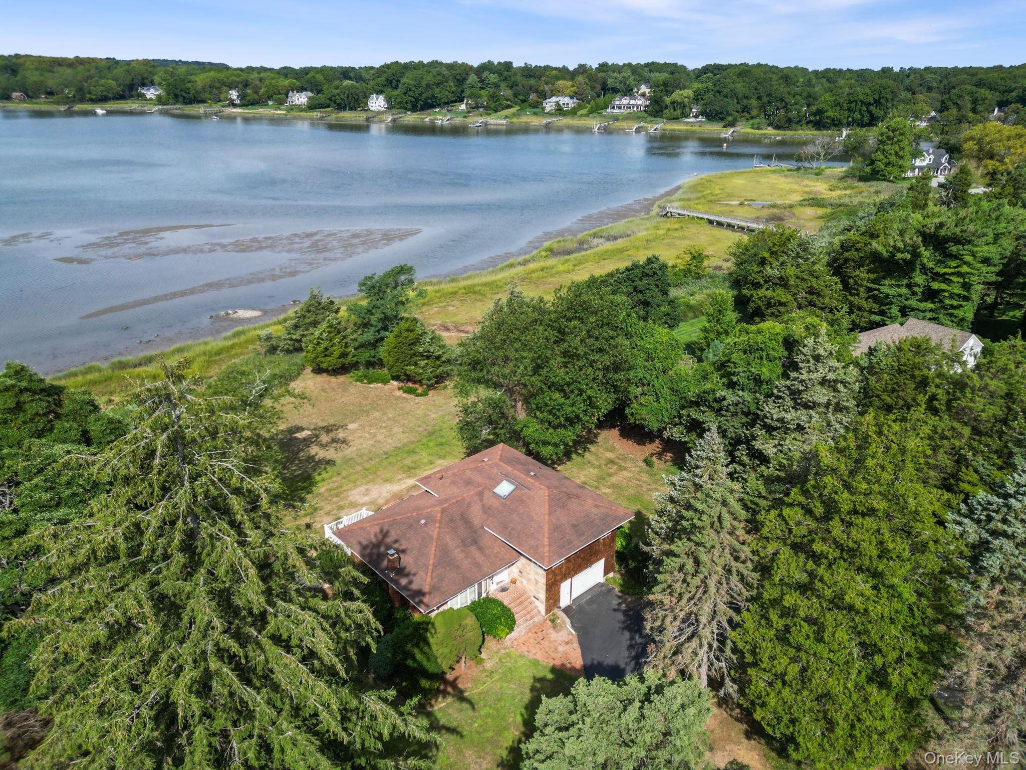 24 Conscience Circle Setauket, NY 11733 - Photo 27 of 31 an aerial view of a house with a lake view