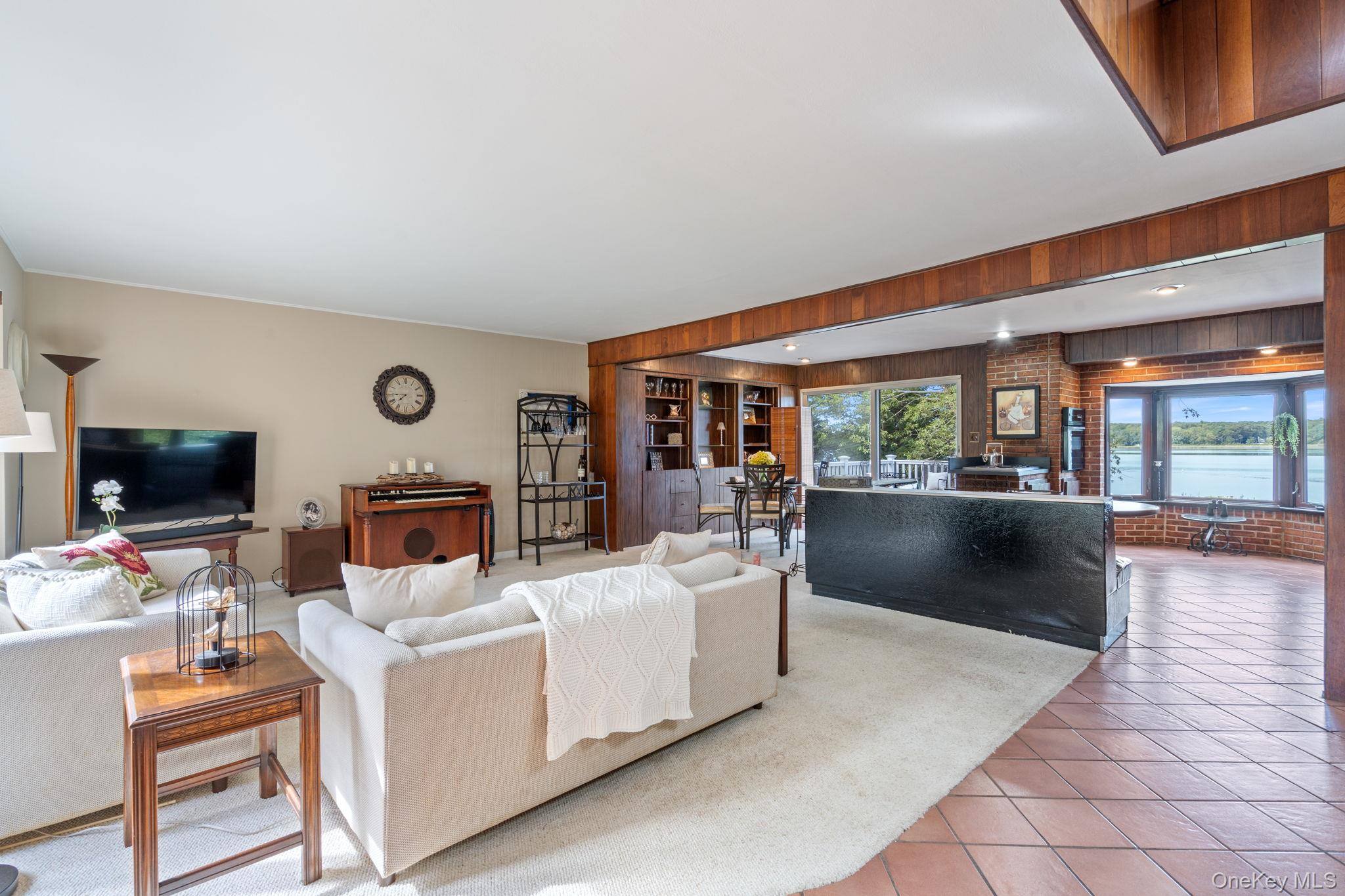 24 Conscience Circle Setauket, NY 11733 - Photo 3 of 31 a living room with furniture and a flat screen tv