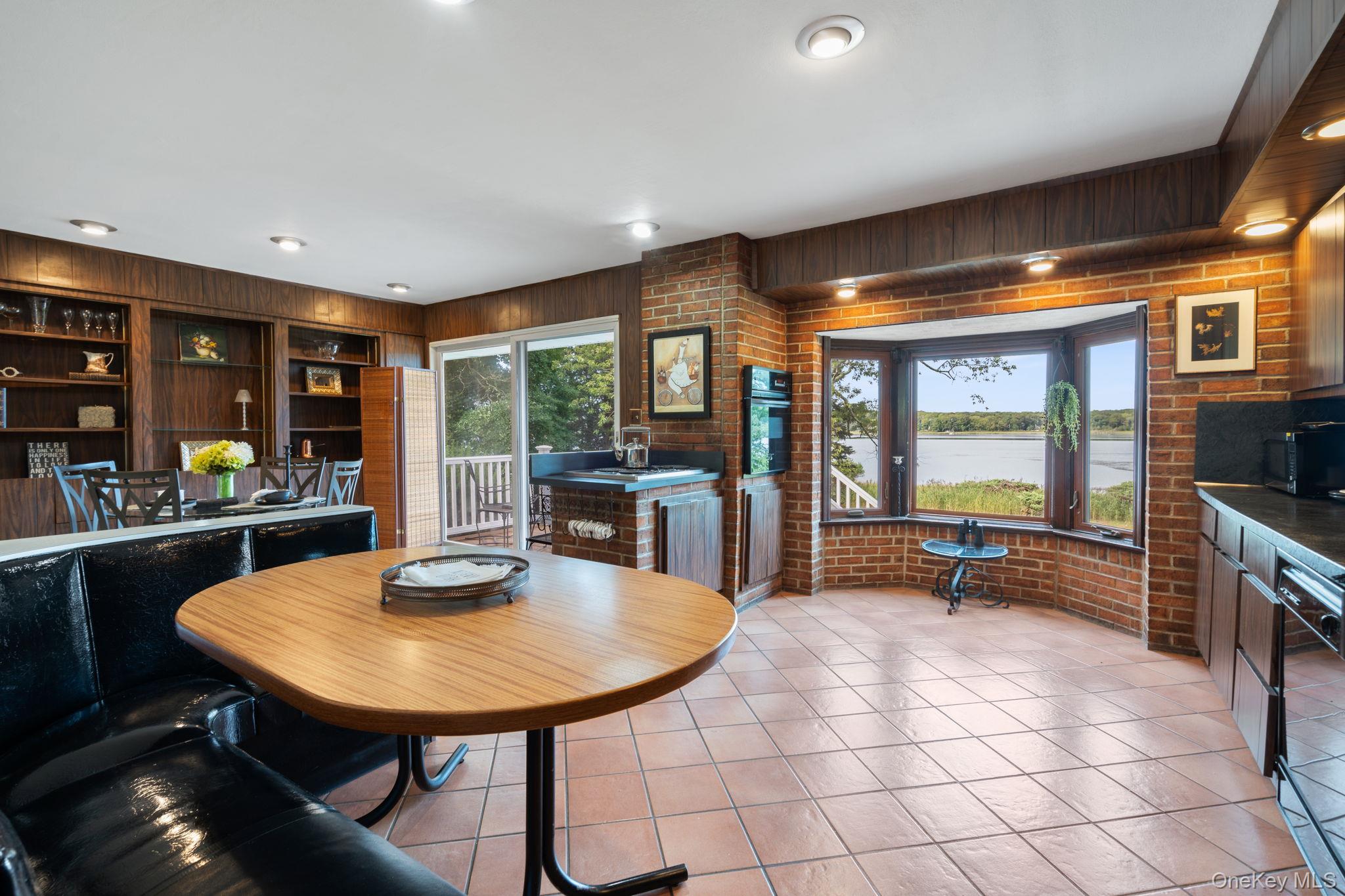 24 Conscience Circle Setauket, NY 11733 - Photo 8 of 31 a view of a dining room with furniture and window