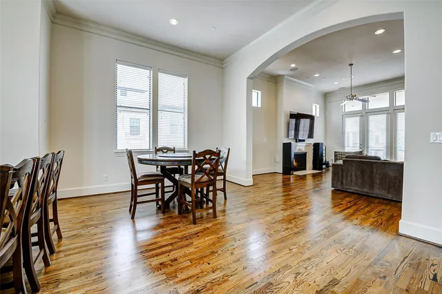 a view of a dining room with furniture and wooden floor