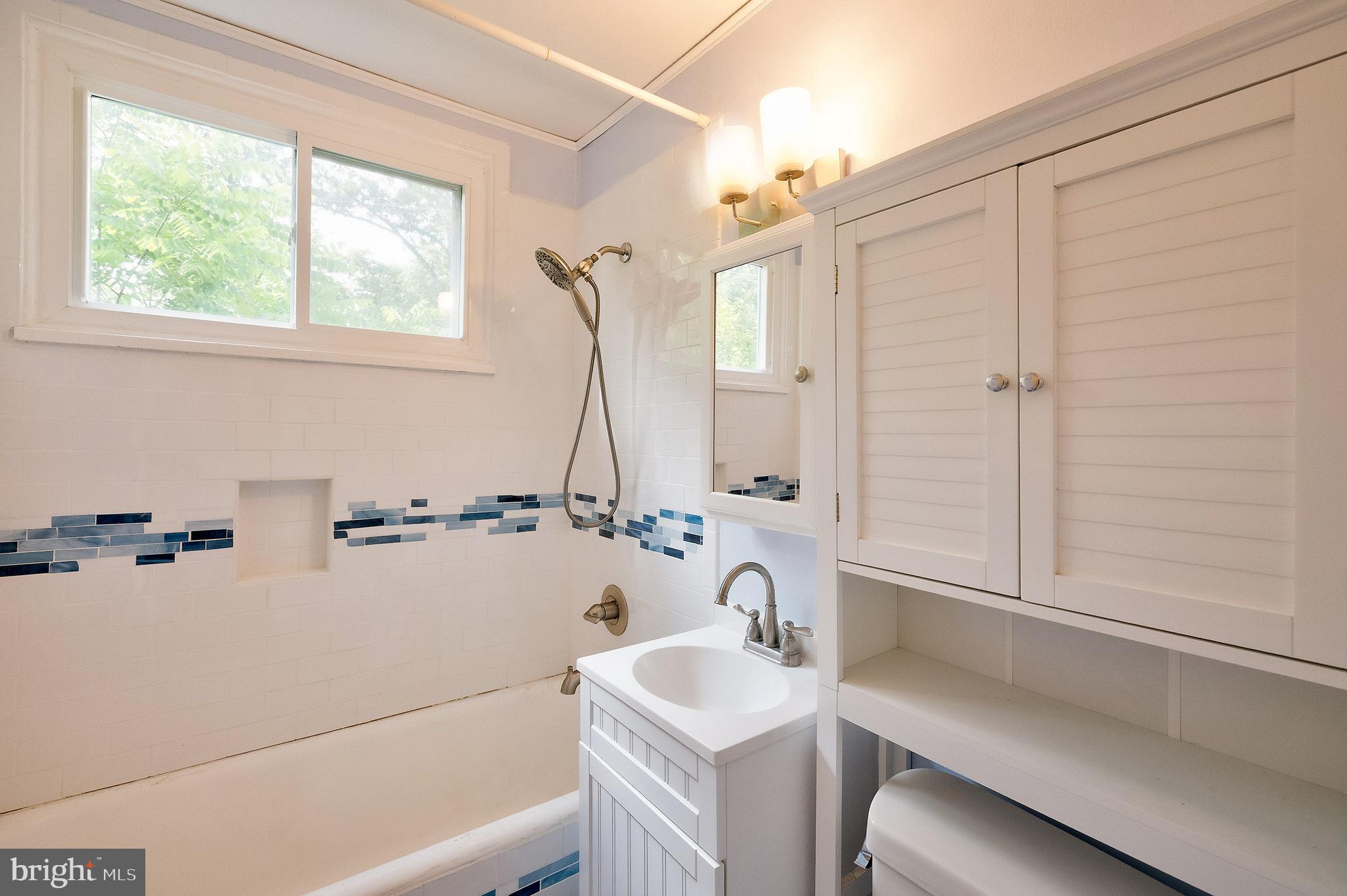 52 Ridge Road Greenbelt, MD 20770 - Photo 29 of 35 a bathroom with a sink and a bathtub