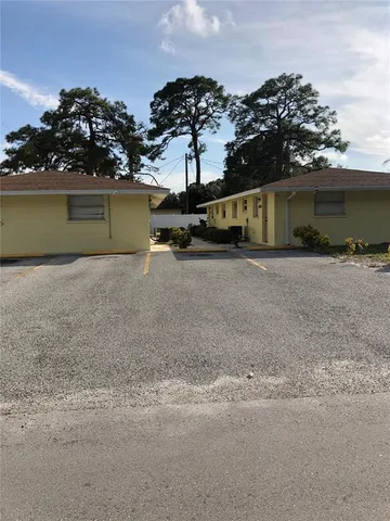 front view of a house with a yard and a garage