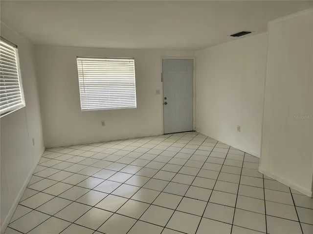 a view of an empty room and window