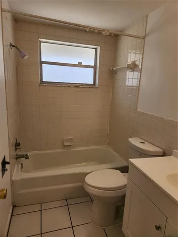 a bathroom with a toilet a sink and bathtub