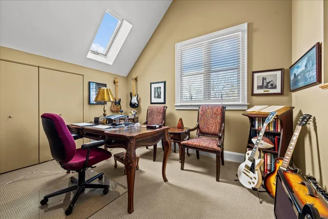 a view of a livingroom with furniture and a window
