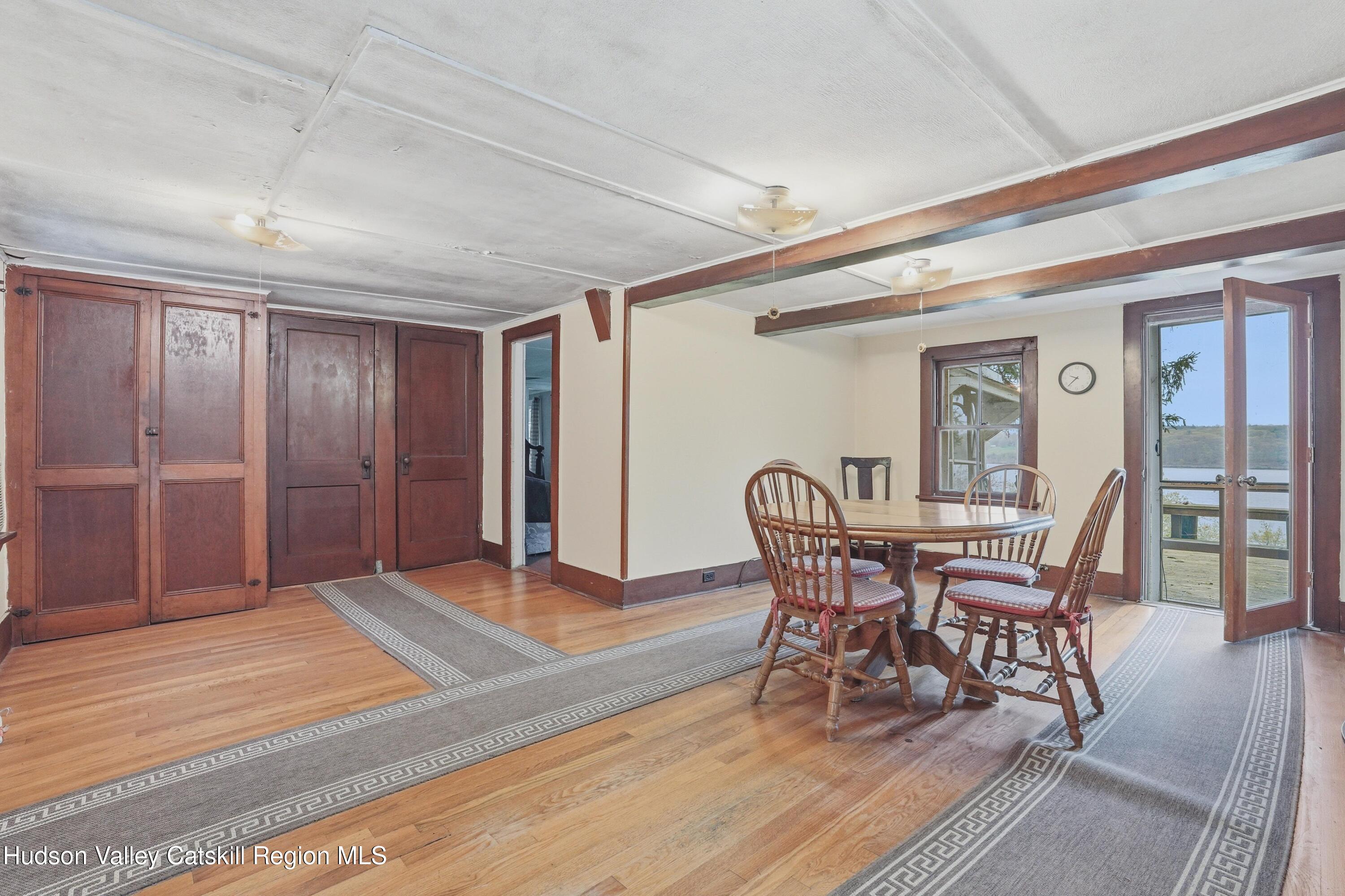 167 Patterson Road West Camp, NY 12490 - Photo 12 of 43 a view of a dining room with furniture and wooden floor