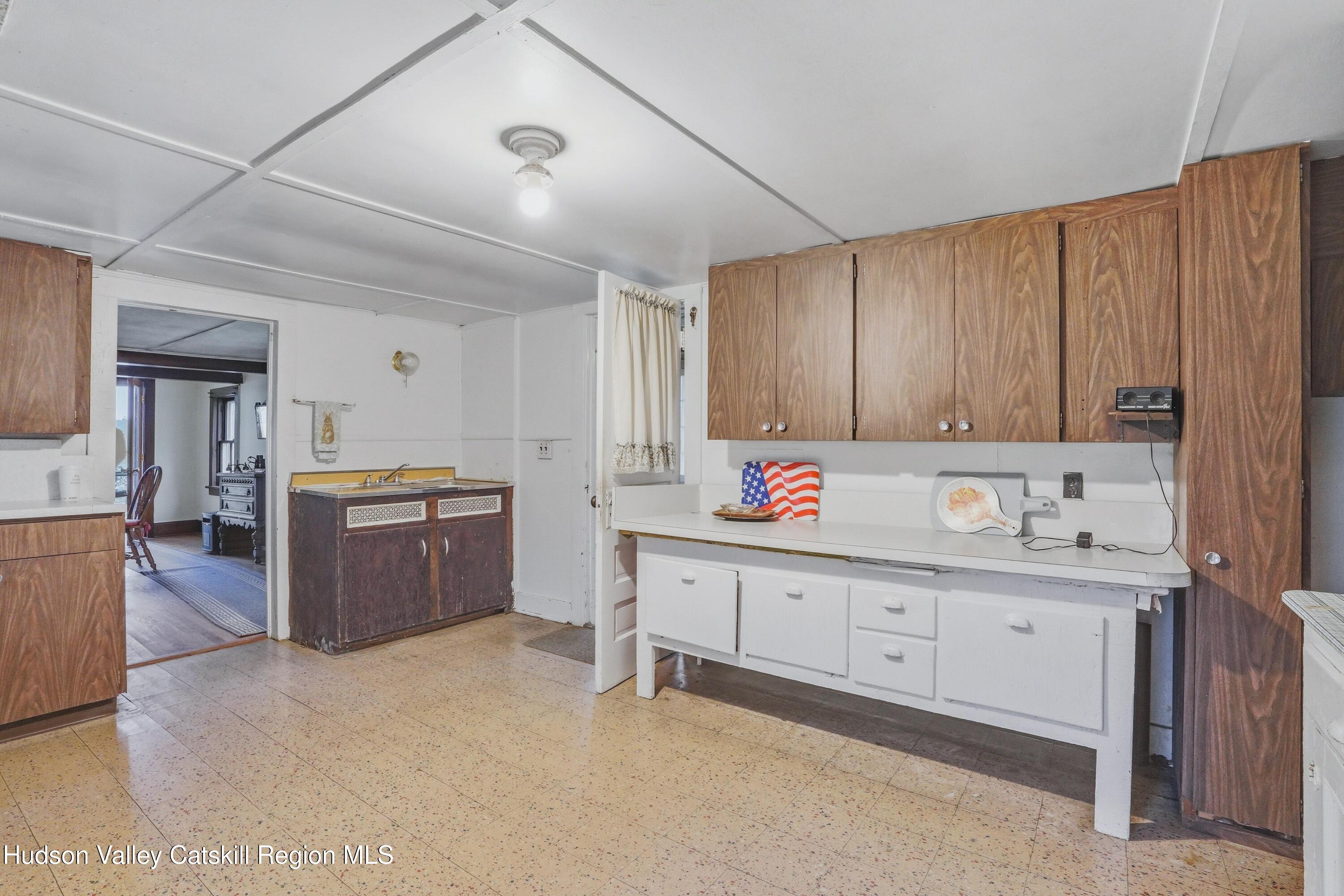 167 Patterson Road West Camp, NY 12490 - Photo 15 of 43 a kitchen with granite countertop a sink cabinets and window