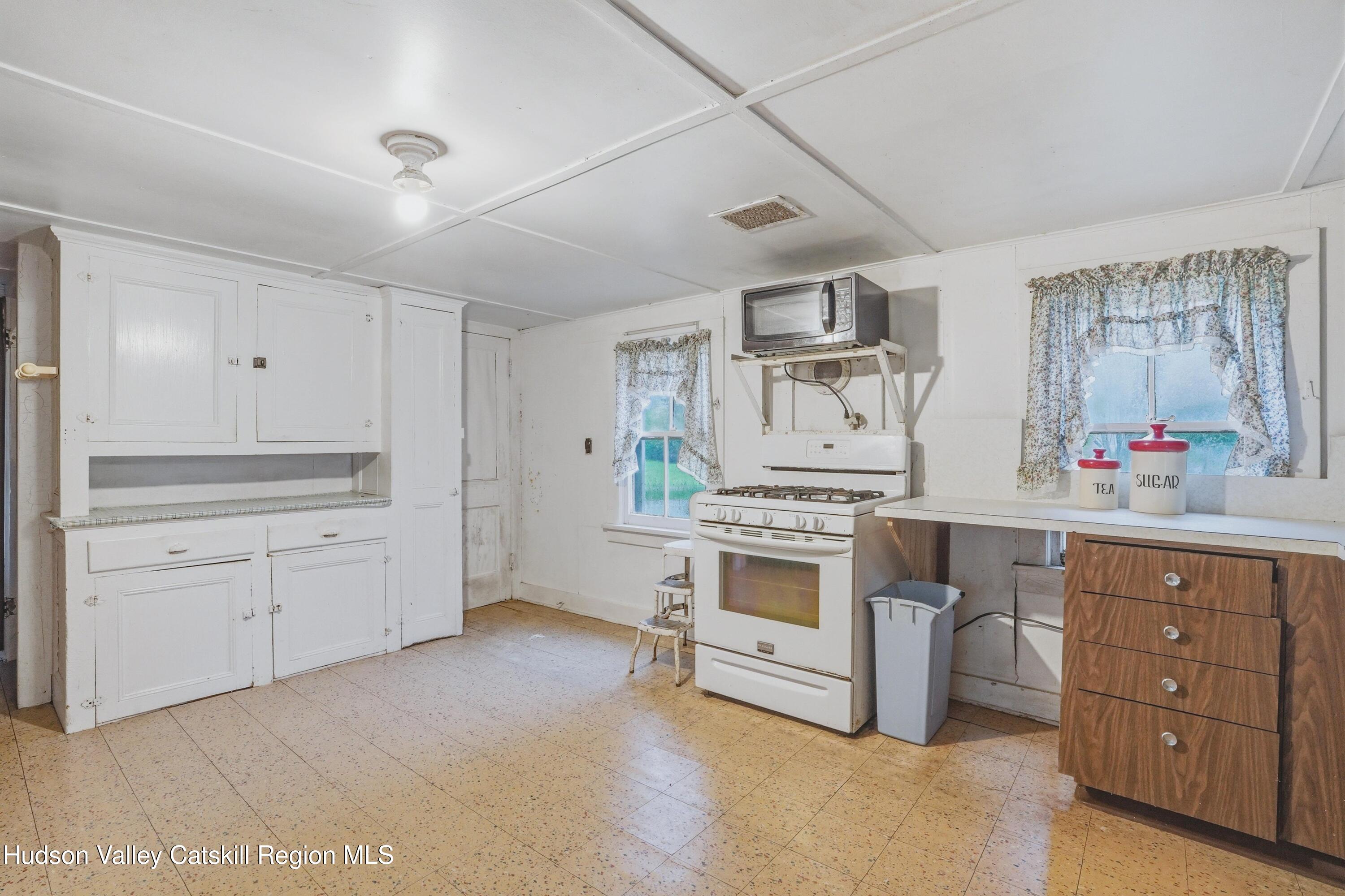 167 Patterson Road West Camp, NY 12490 - Photo 17 of 43 a kitchen with granite countertop a sink stove and cabinets