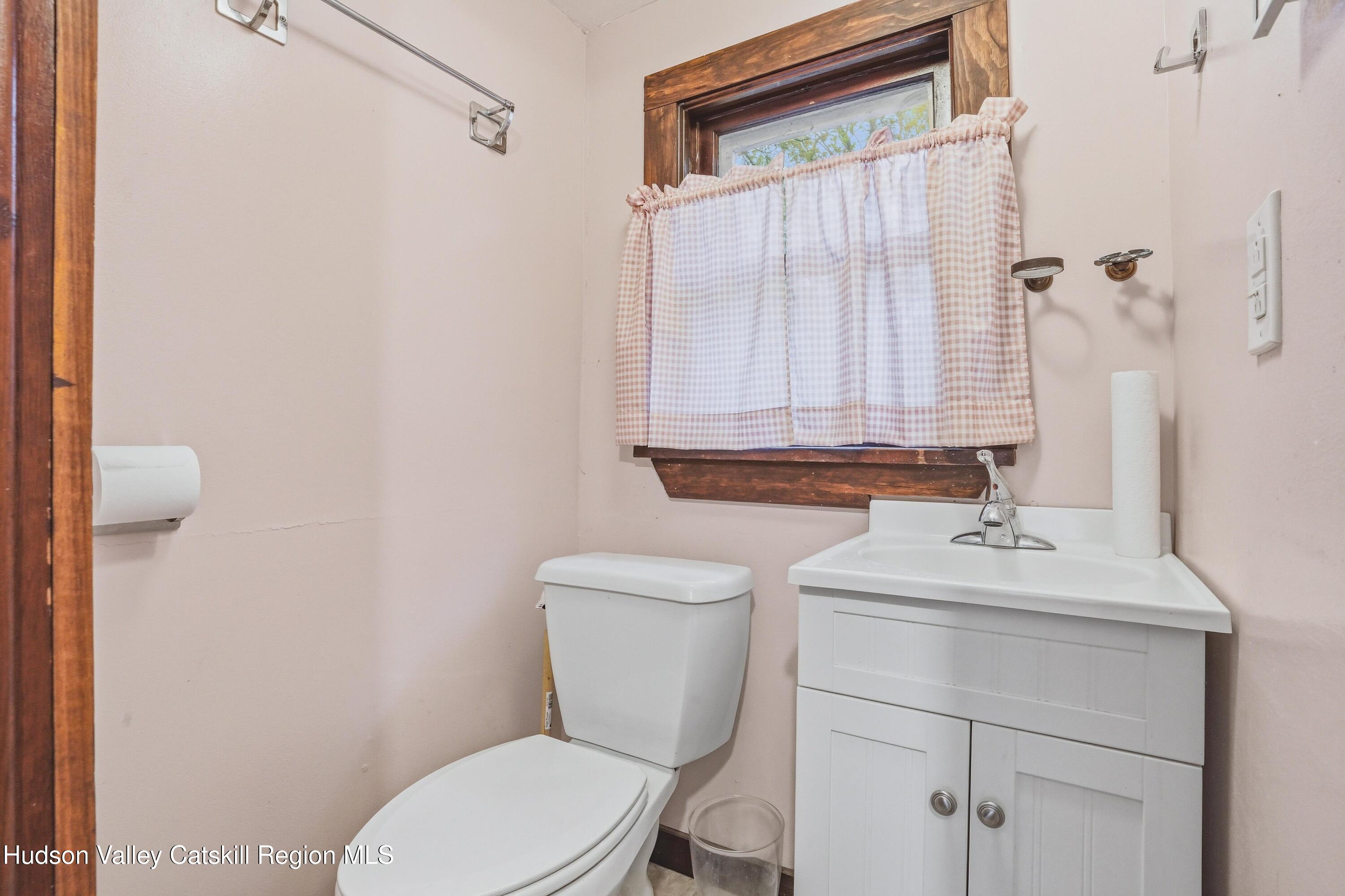 167 Patterson Road West Camp, NY 12490 - Photo 18 of 43 a bathroom with a sink a toilet and a mirror