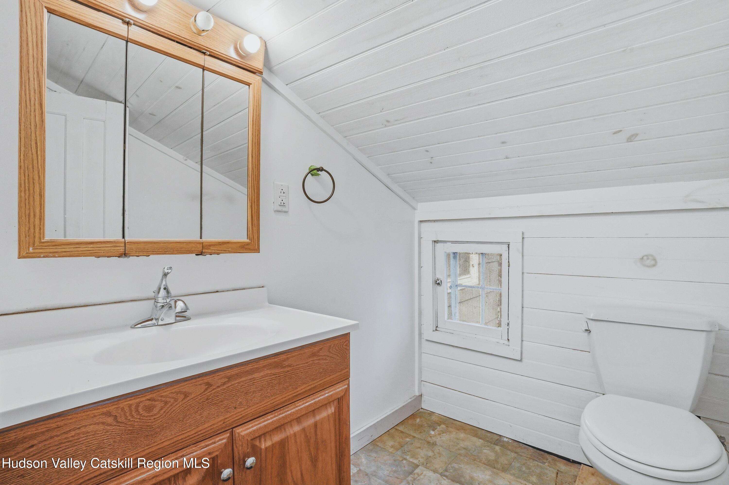 167 Patterson Road West Camp, NY 12490 - Photo 20 of 43 a bathroom with a sink a toilet and vanity