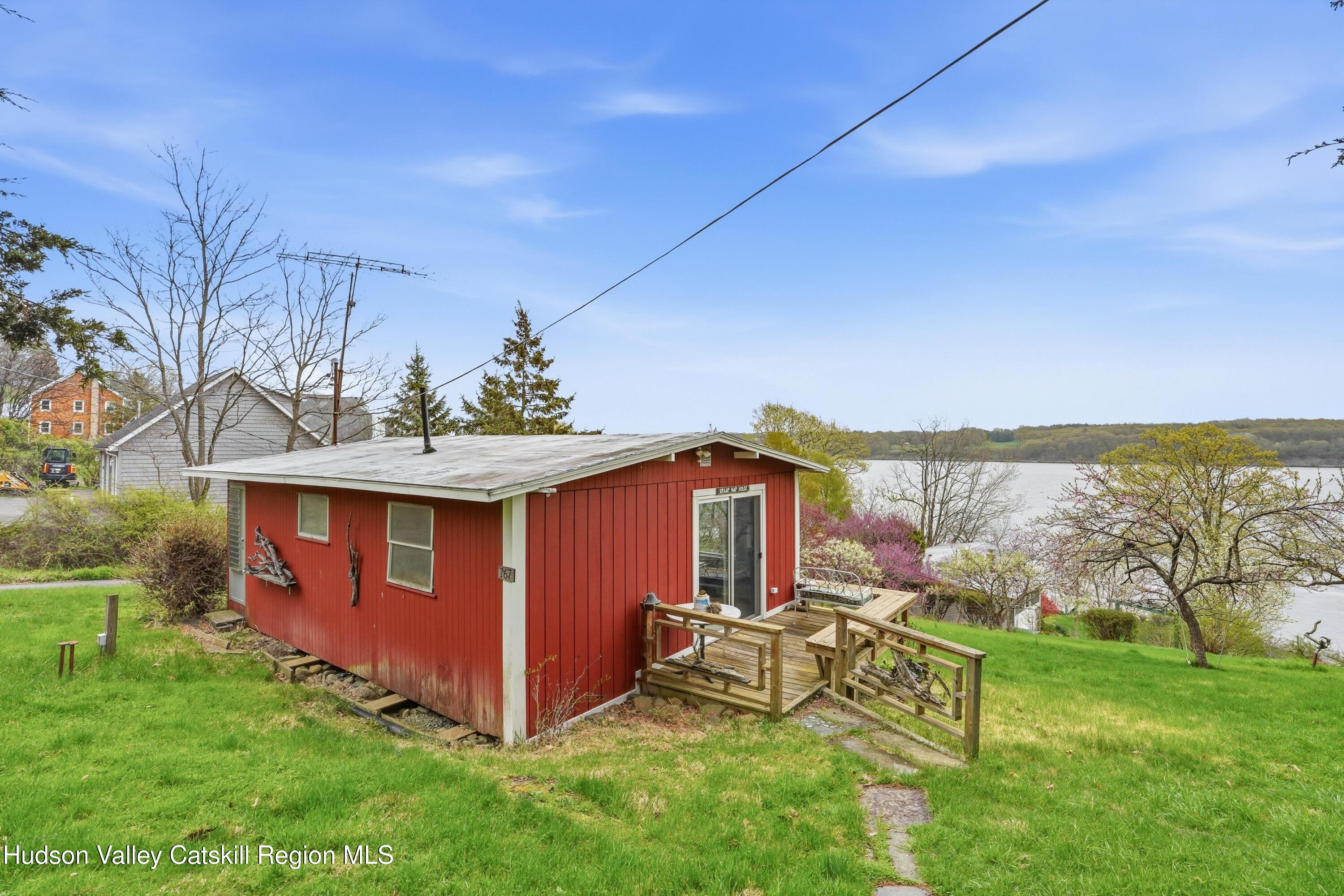 167 Patterson Road West Camp, NY 12490 - Photo 2 of 43 a view of a backyard with a garden and outdoor seating