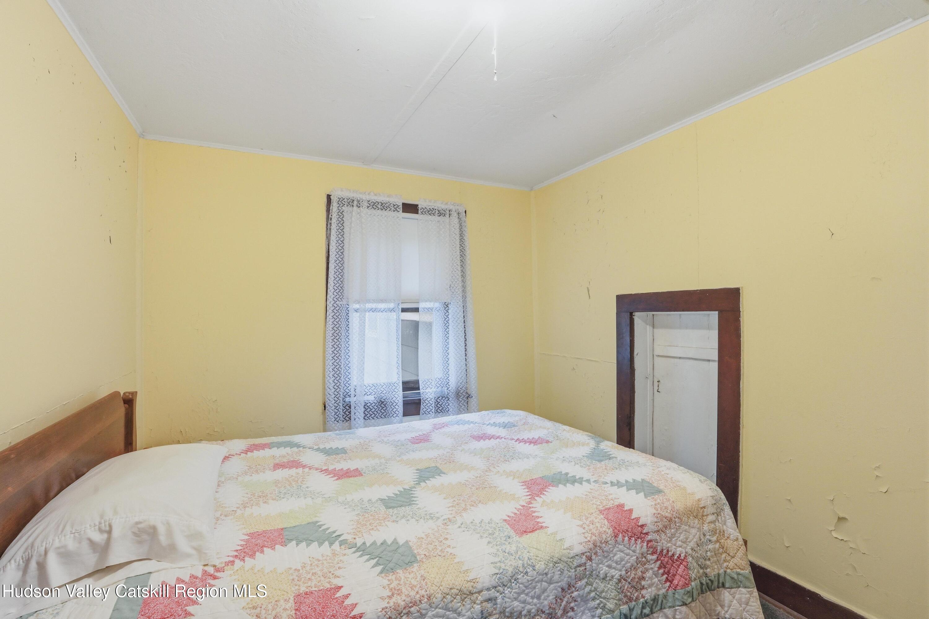 167 Patterson Road West Camp, NY 12490 - Photo 22 of 43 a bedroom with a bed and a mirror