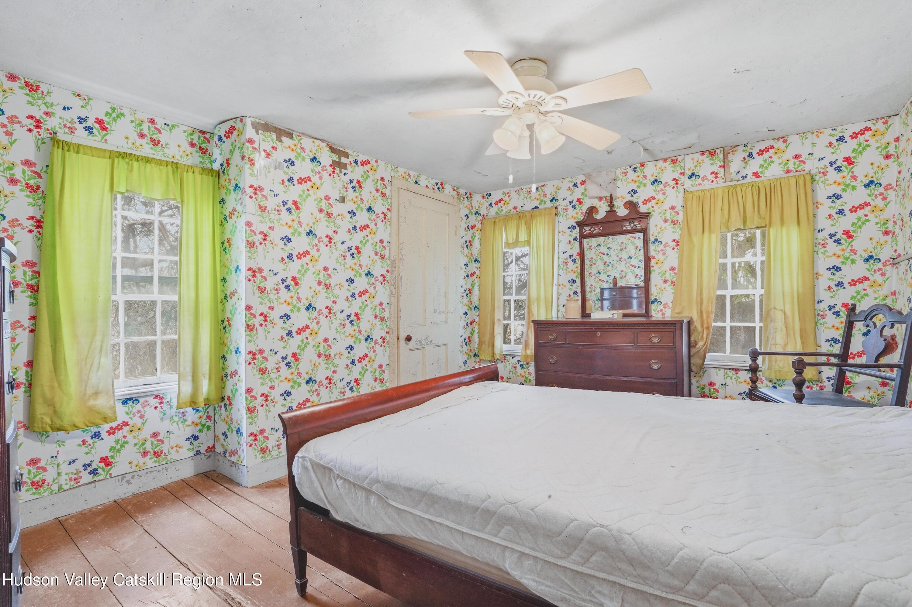 167 Patterson Road West Camp, NY 12490 - Photo 25 of 43 a bedroom with a bed and a chandelier