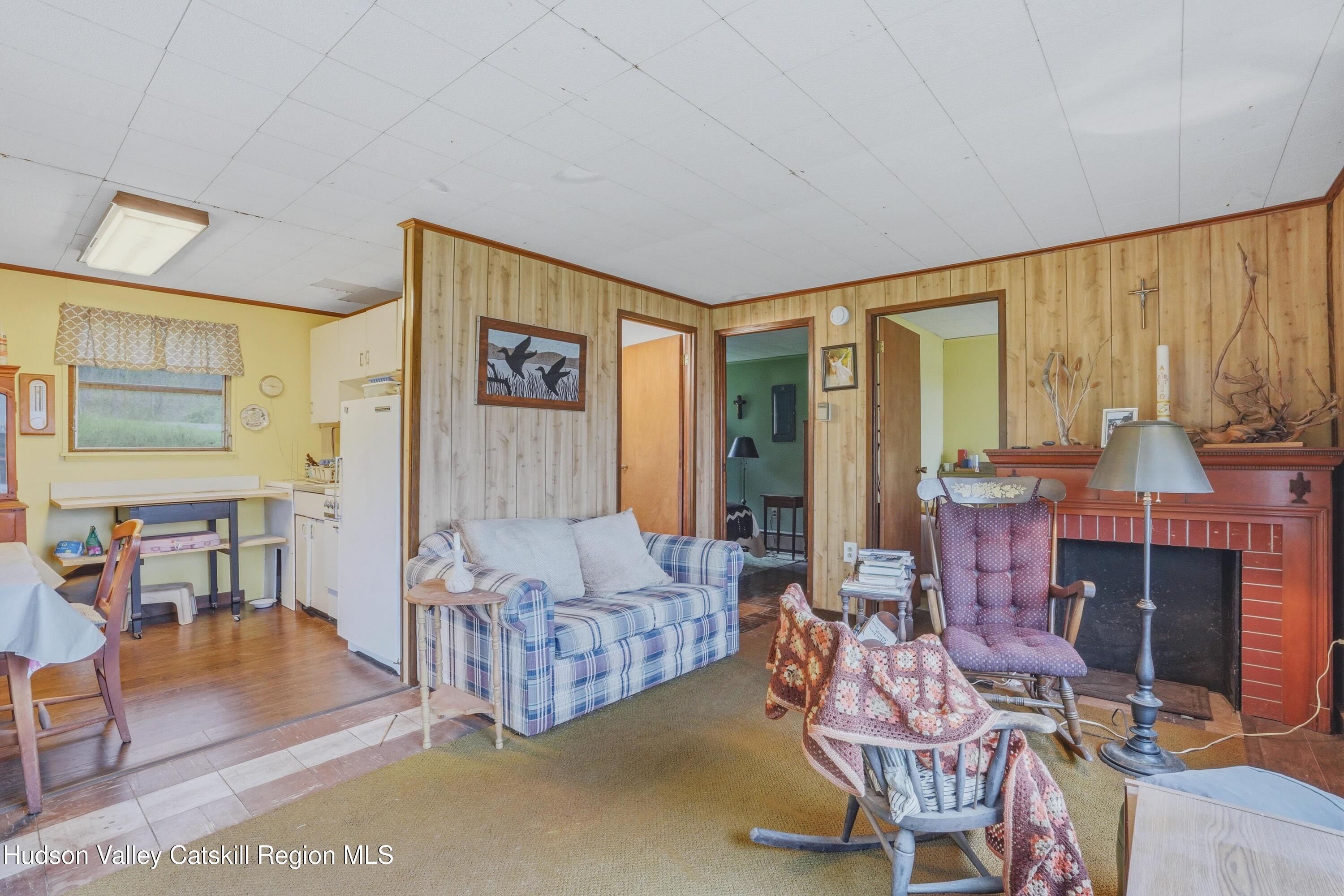 167 Patterson Road West Camp, NY 12490 - Photo 32 of 43 a living room with furniture and a fireplace