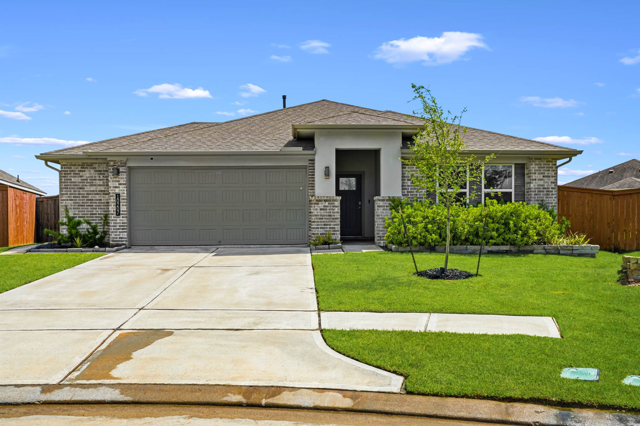 10207 Alpine Lake Lane Rosharon, TX 77583 - Photo 1 of 30 a front view of a house with a garden