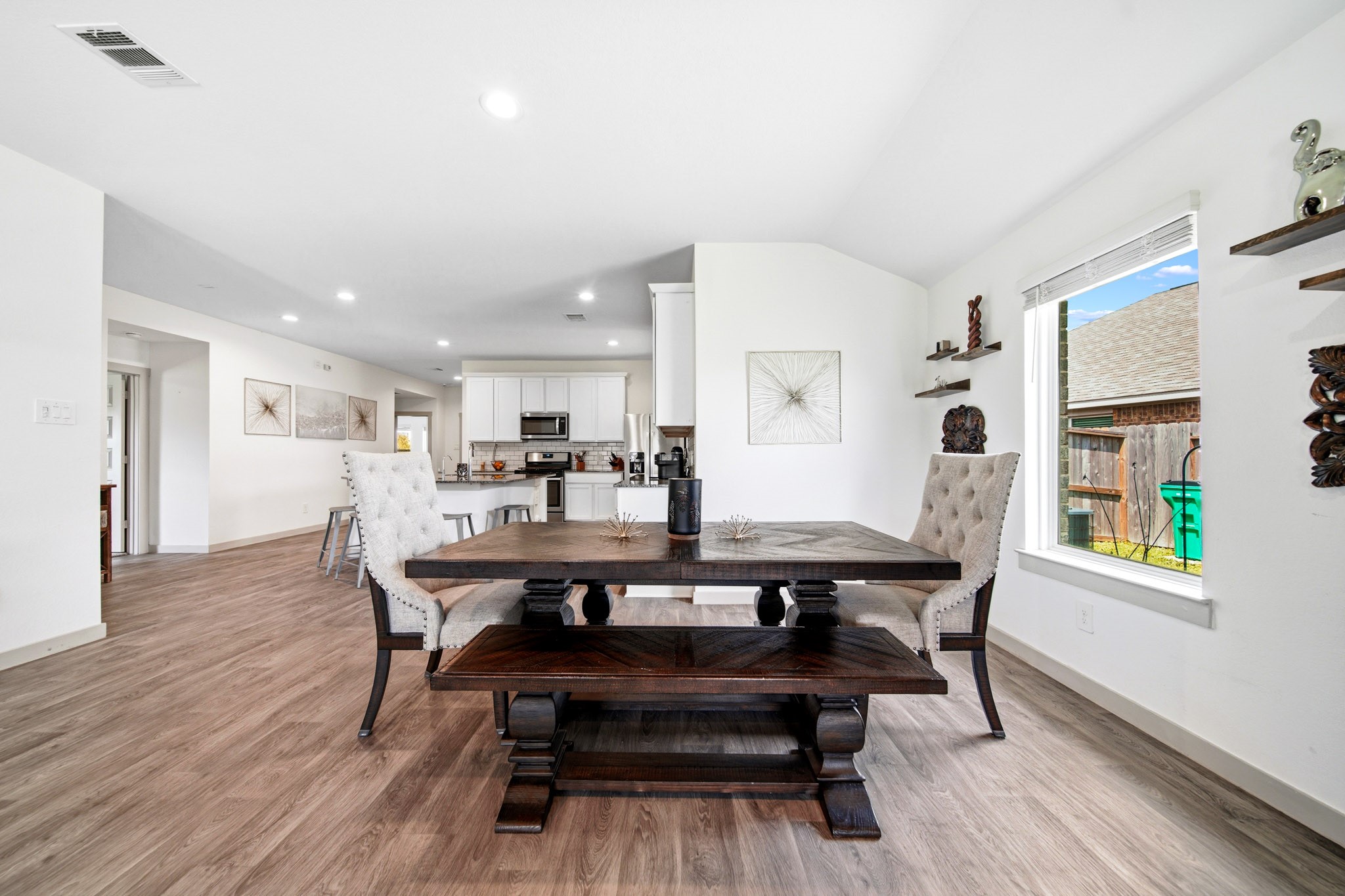 10207 Alpine Lake Lane Rosharon, TX 77583 - Photo 11 of 30 a view of a dining room with furniture and wooden floor