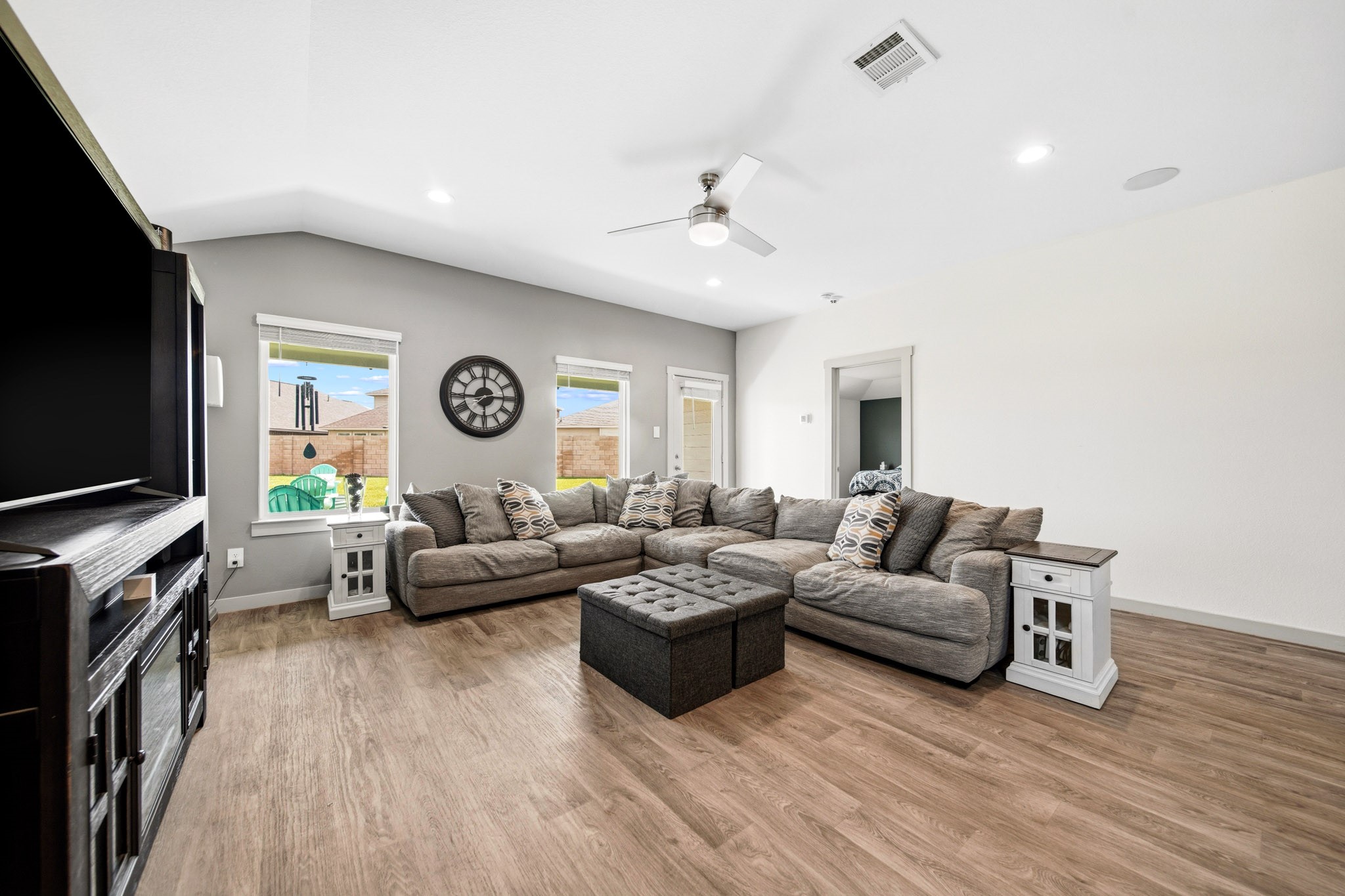 10207 Alpine Lake Lane Rosharon, TX 77583 - Photo 6 of 30 a living room with furniture flat screen tv and a window