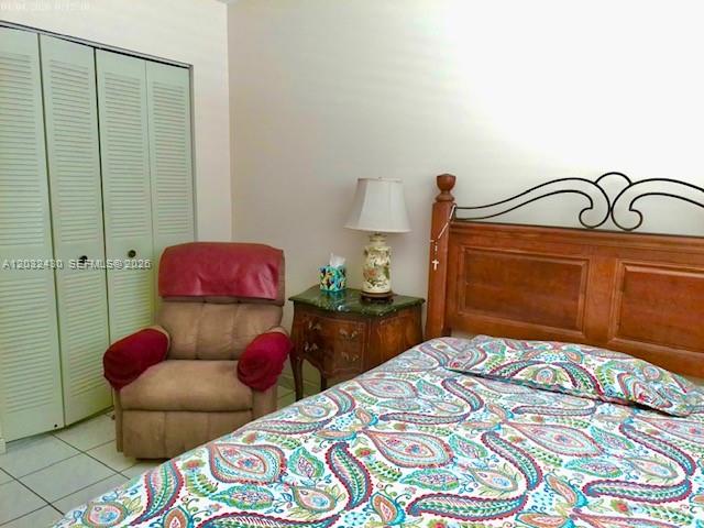 6527 West 22nd Lane Hialeah, FL 33016 - Photo 13 of 18 a bedroom with a bed and a window