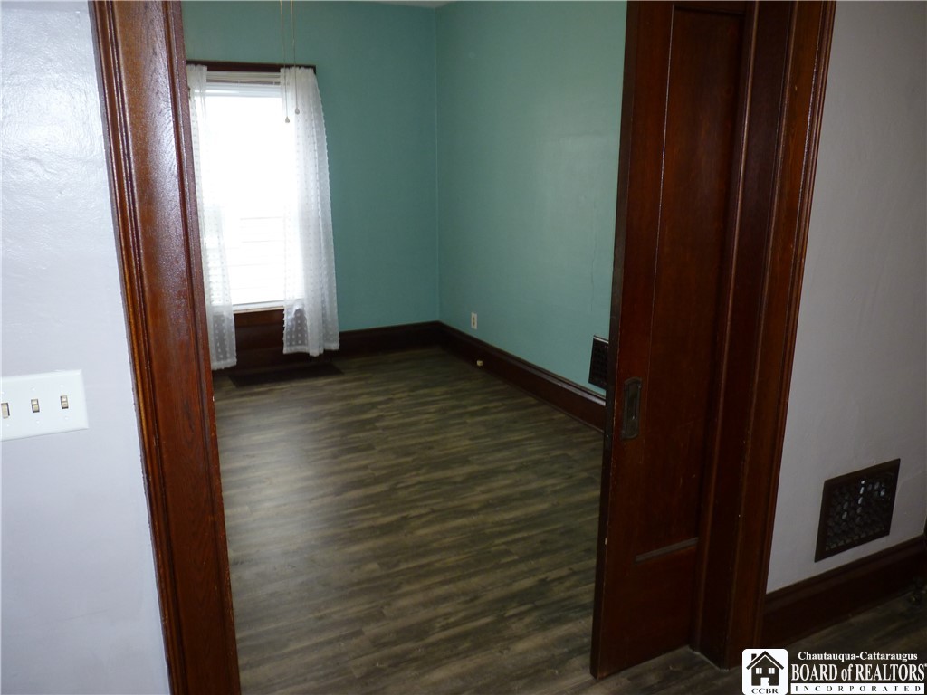 70 Pershing Avenue Jamestown, NY 14701 - Photo 12 of 34 Pocket doors to first floor bedroom