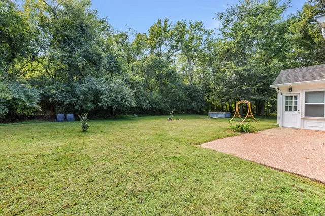 a backyard of a house with lots of green space