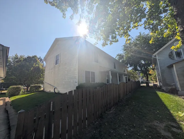 a view of a house with a yard