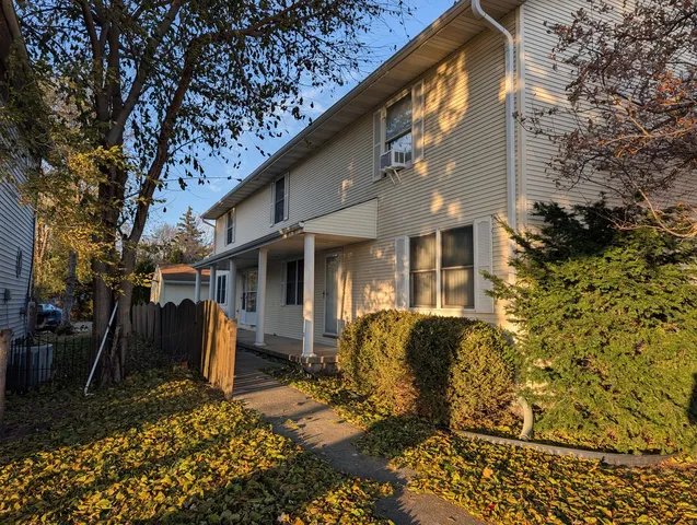 a view of house with outdoor space and seating area