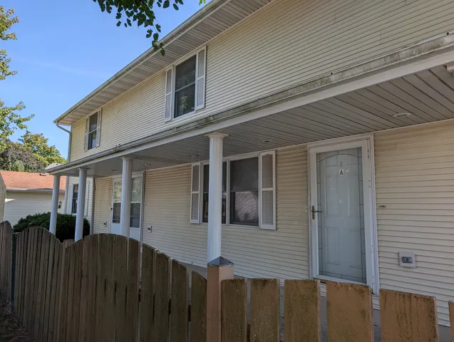 a front view of a house with yard