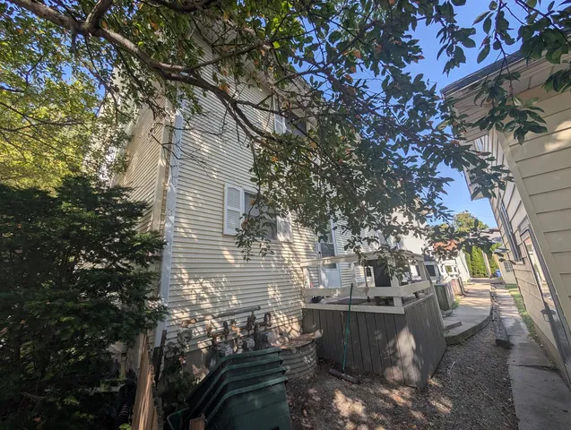 a bathroom with a sink vanity mirror and toilet