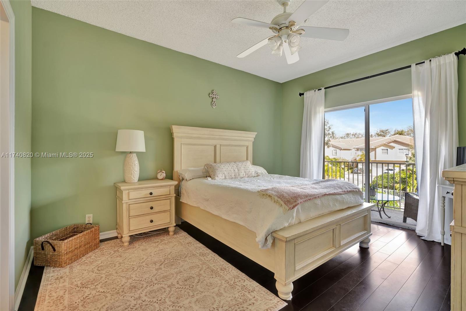112 Lighthouse Circle, Unit H Tequesta, FL 33469 - Photo 14 of 39 a bed room with a bed and a chandelier