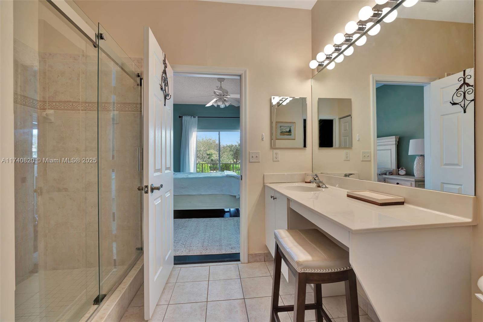 112 Lighthouse Circle, Unit H Tequesta, FL 33469 - Photo 17 of 39 a kitchen with a sink and chairs