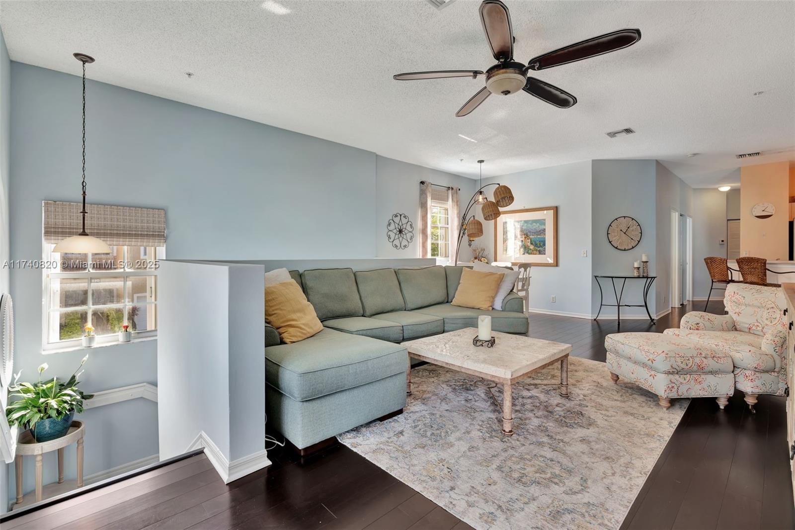 112 Lighthouse Circle, Unit H Tequesta, FL 33469 - Photo 2 of 39 a living room with furniture and a window