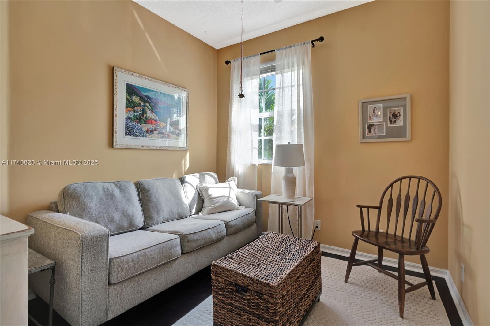 112 Lighthouse Circle, Unit H Tequesta, FL 33469 - Photo 22 of 39 a living room with furniture and a window