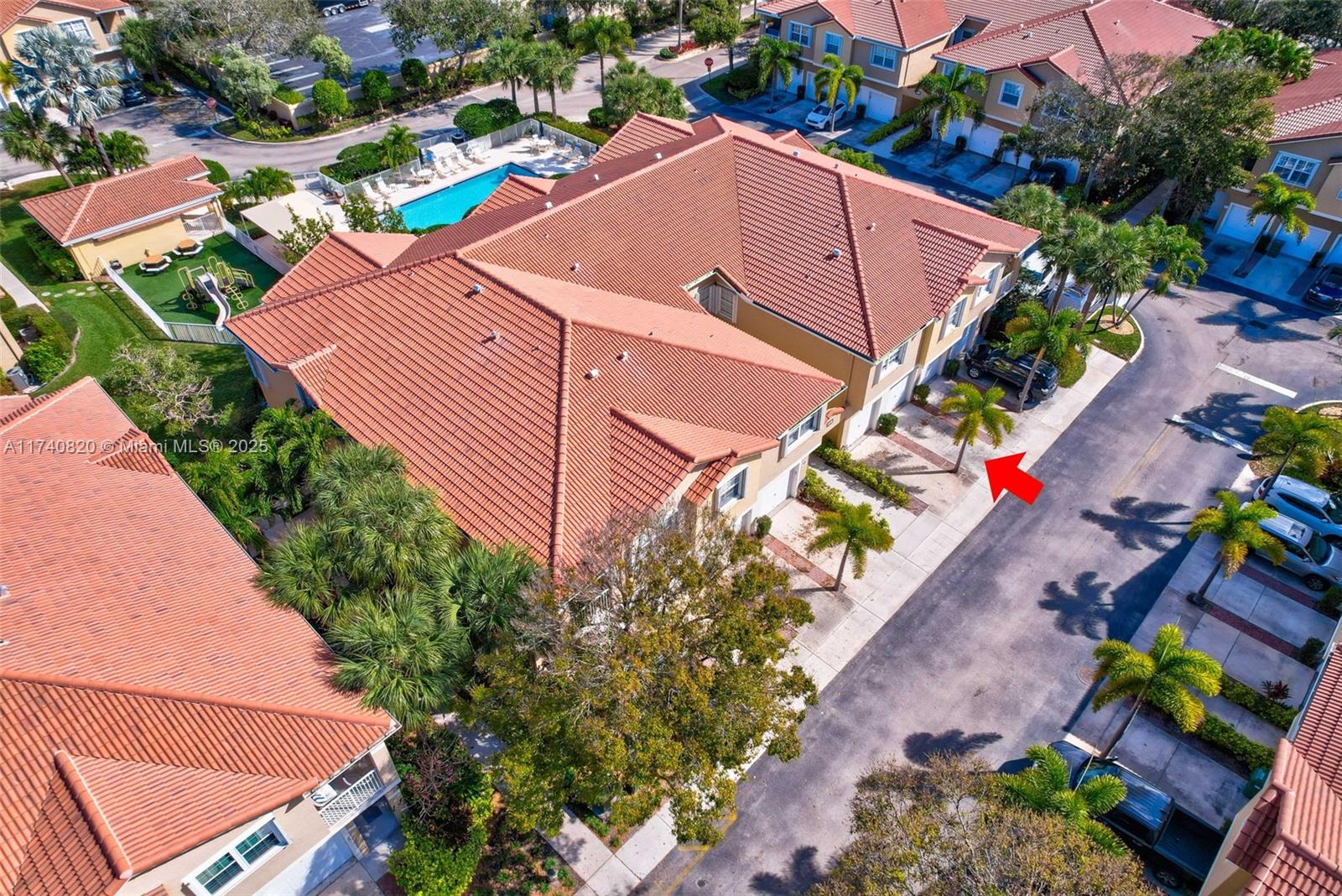 112 Lighthouse Circle, Unit H Tequesta, FL 33469 - Photo 28 of 39 an aerial view of a house with a yard and potted plants