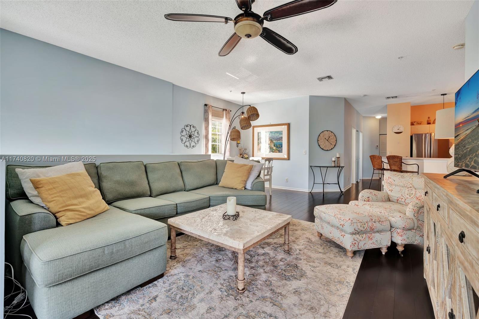 112 Lighthouse Circle, Unit H Tequesta, FL 33469 - Photo 3 of 39 a living room with furniture and a rug