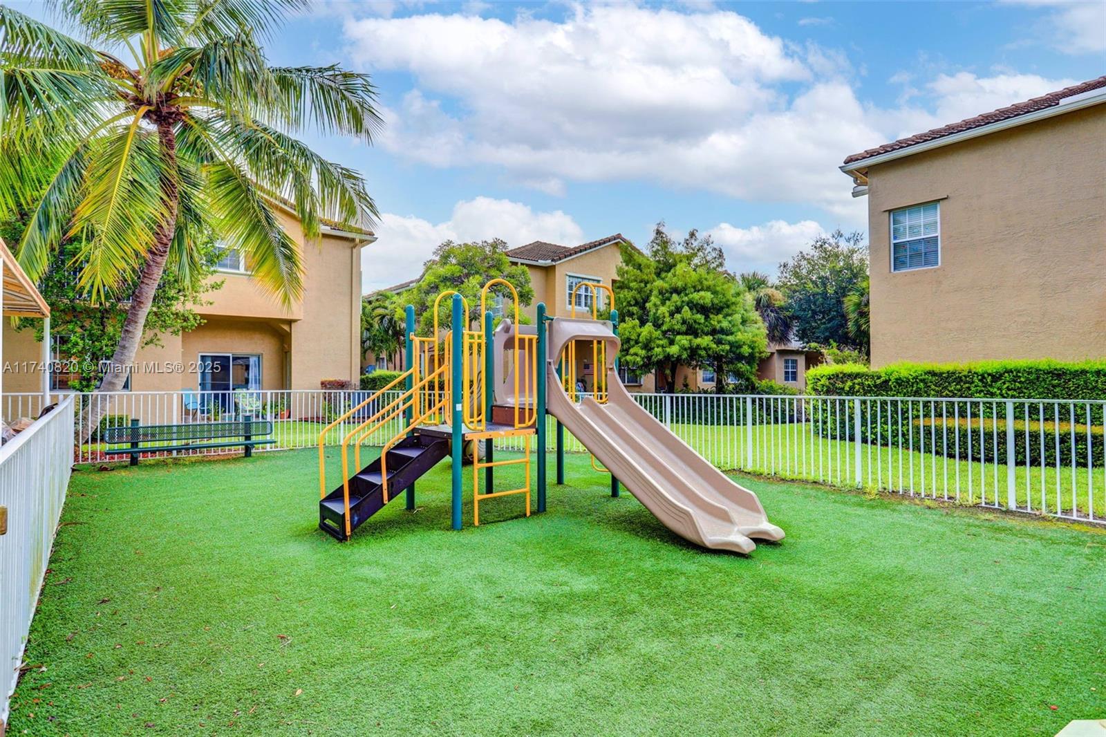 112 Lighthouse Circle, Unit H Tequesta, FL 33469 - Photo 39 of 39 a view of a house with a backyard
