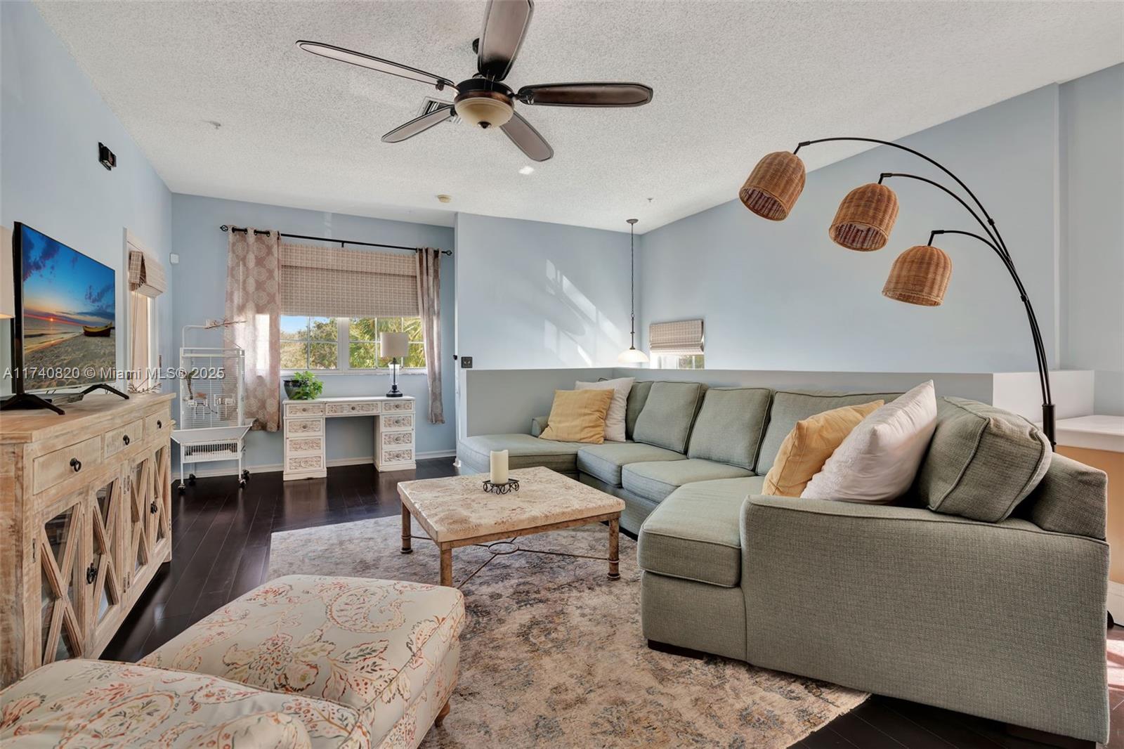 112 Lighthouse Circle, Unit H Tequesta, FL 33469 - Photo 5 of 39 a living room with furniture and a flat screen tv