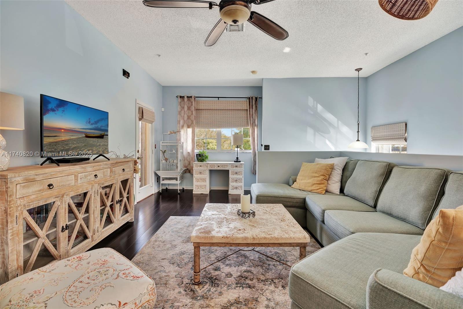 112 Lighthouse Circle, Unit H Tequesta, FL 33469 - Photo 6 of 39 a living room with furniture and a flat screen tv