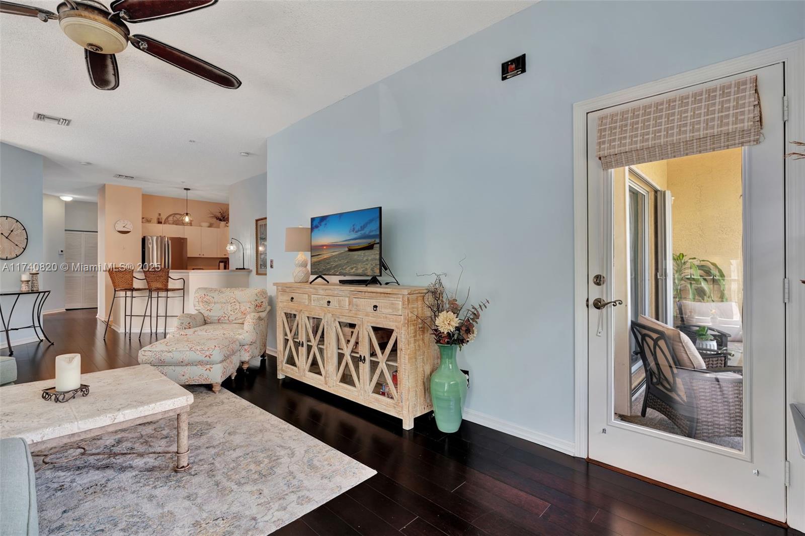 112 Lighthouse Circle, Unit H Tequesta, FL 33469 - Photo 8 of 39 a bed room with furniture and wooden floor