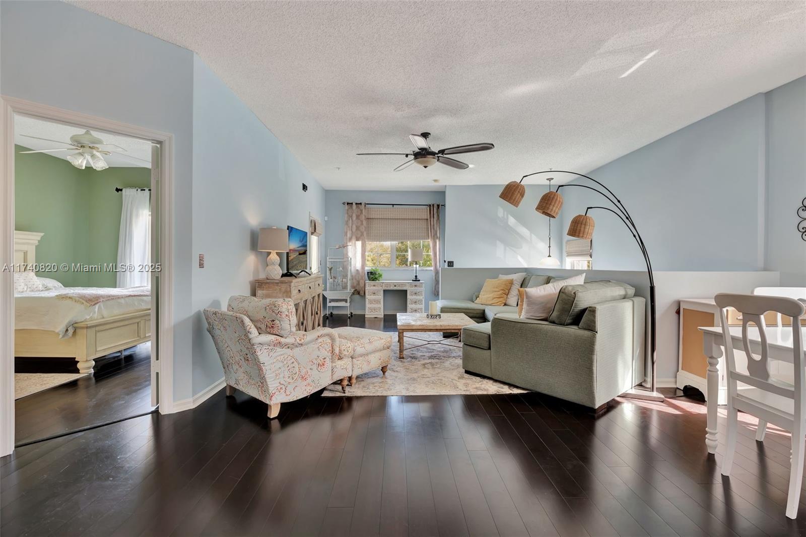 112 Lighthouse Circle, Unit H Tequesta, FL 33469 - Photo 10 of 39 a living room with fireplace furniture and a large window