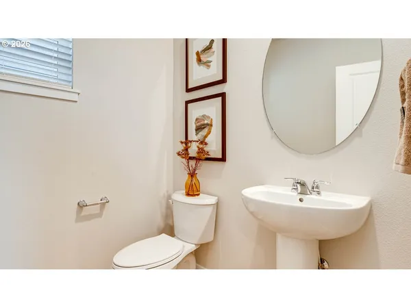 a bathroom with a sink a mirror and a toilet