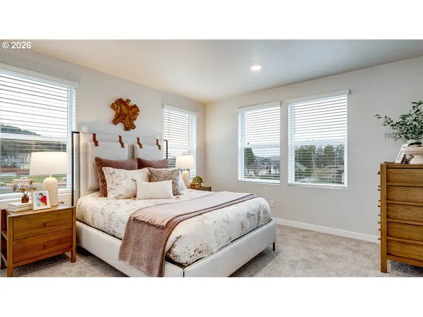 a bed room with a bed and a window