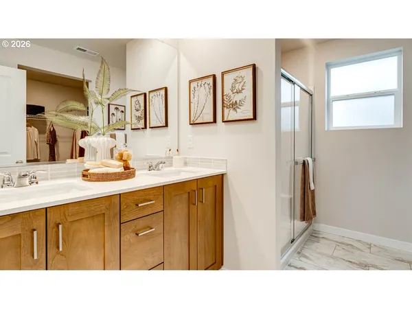 a bathroom with a sink double vanity and a mirror
