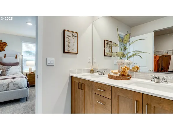 a bathroom with a sink double vanity and mirror