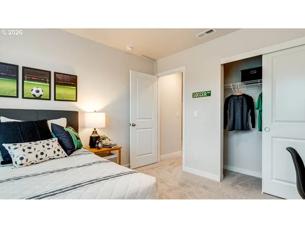 a bedroom with a bed and cabinets