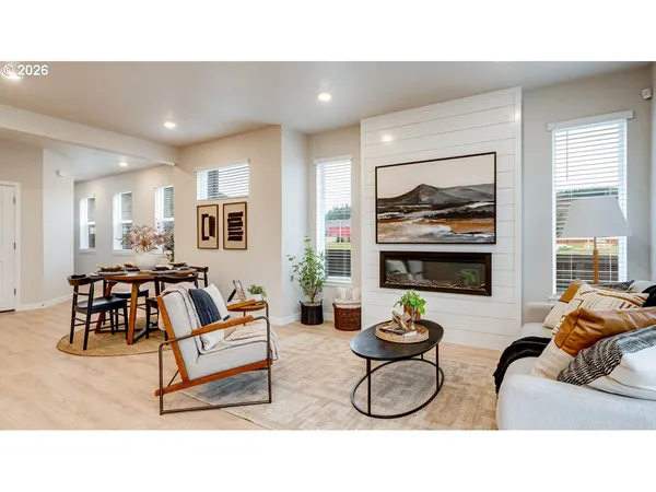 a living room with furniture and a table